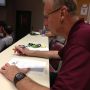 Judge @CoachJonLeamy, hard at work judging #mgt413 Create-A-Wrestler. 