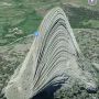 Apple Maps made Devils Tower National Monument melt upon itself. That's the top of the Tower on the ground to the left.